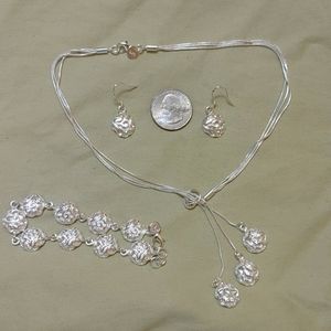 New silver rose necklace, earrings and bracelet set.